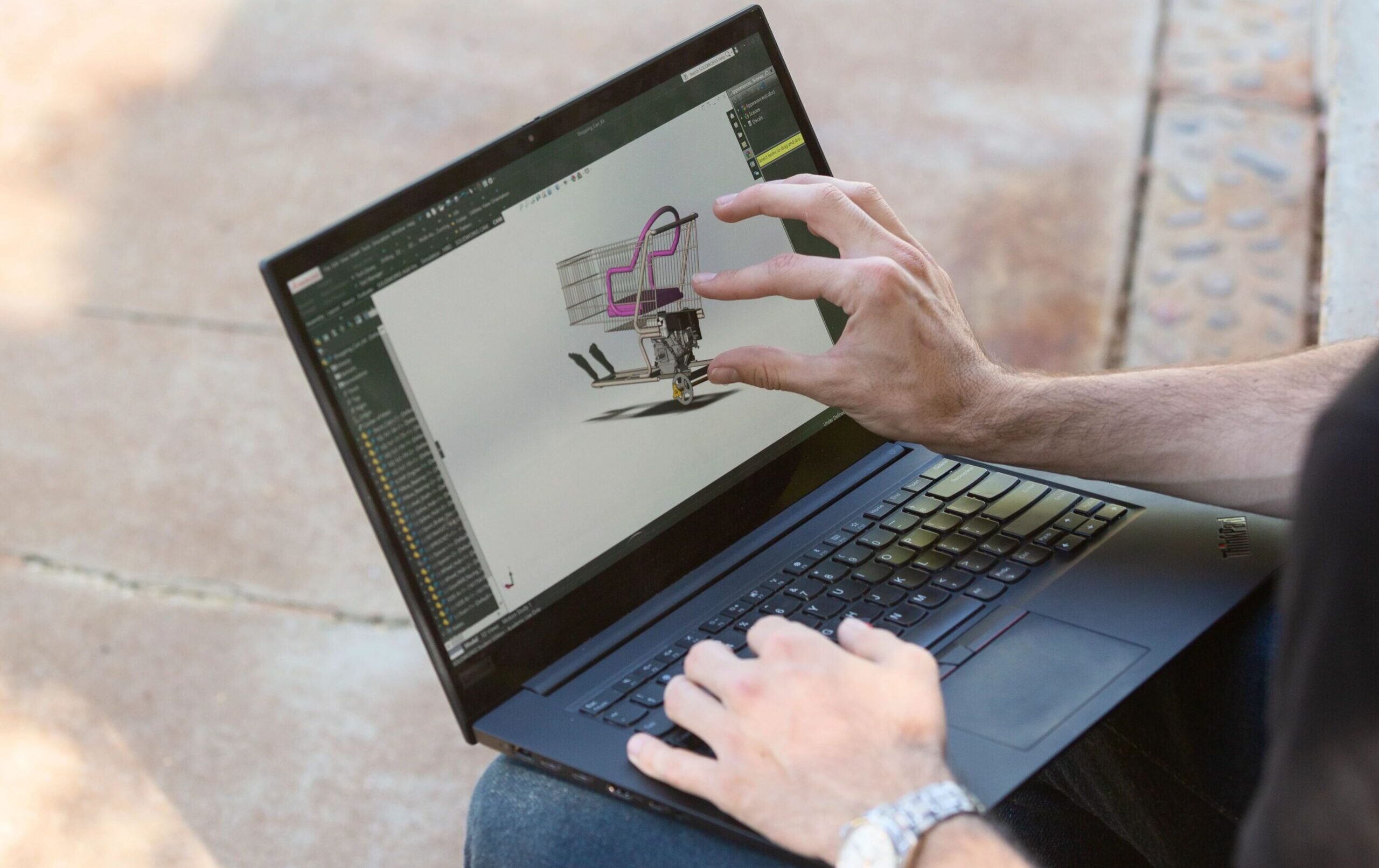 Student using CAD software on laptop computer